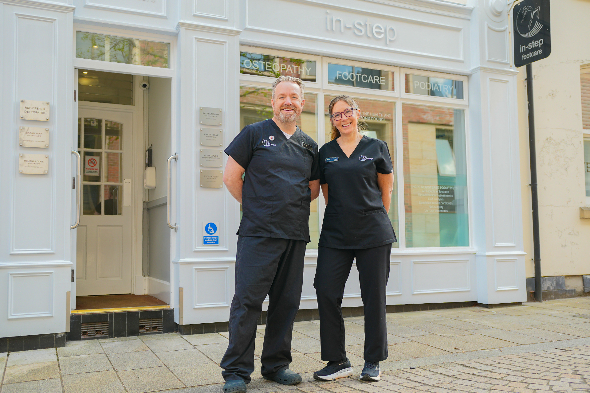Instep Footcare team standing outside the clinic on Greenwood Street, Altrincham